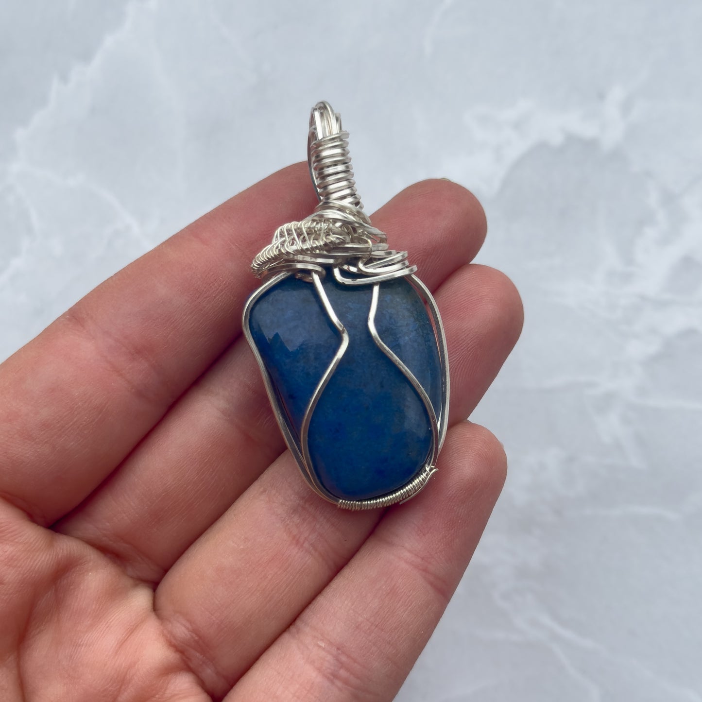 Handmade silver wire wrapped unknown blue stone pendant